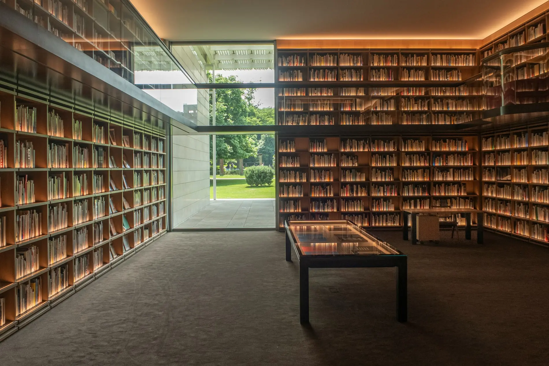 A modern research library with floor-to-ceiling collections and a quiet reading space